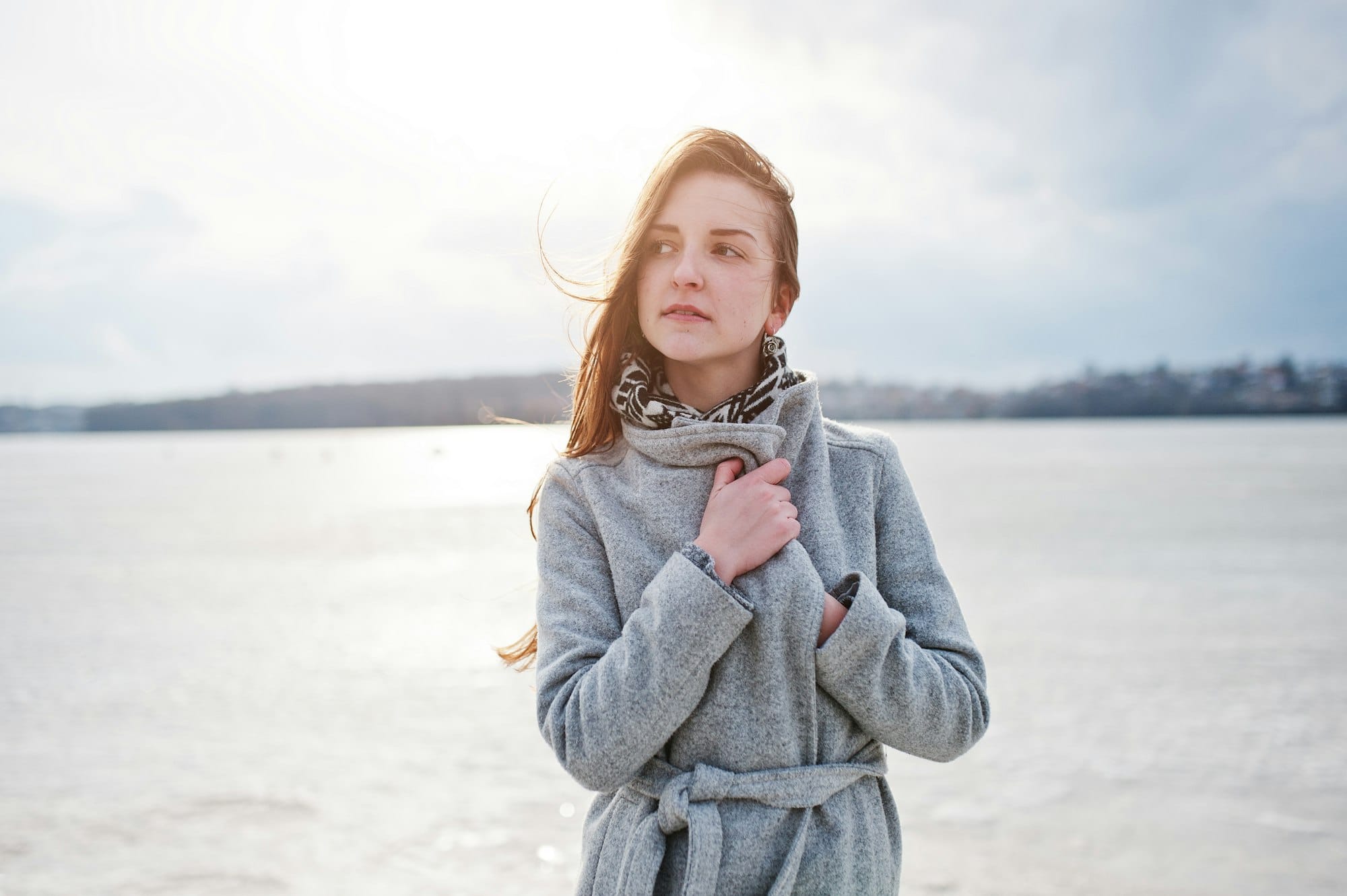 Young model girl in a gray coat